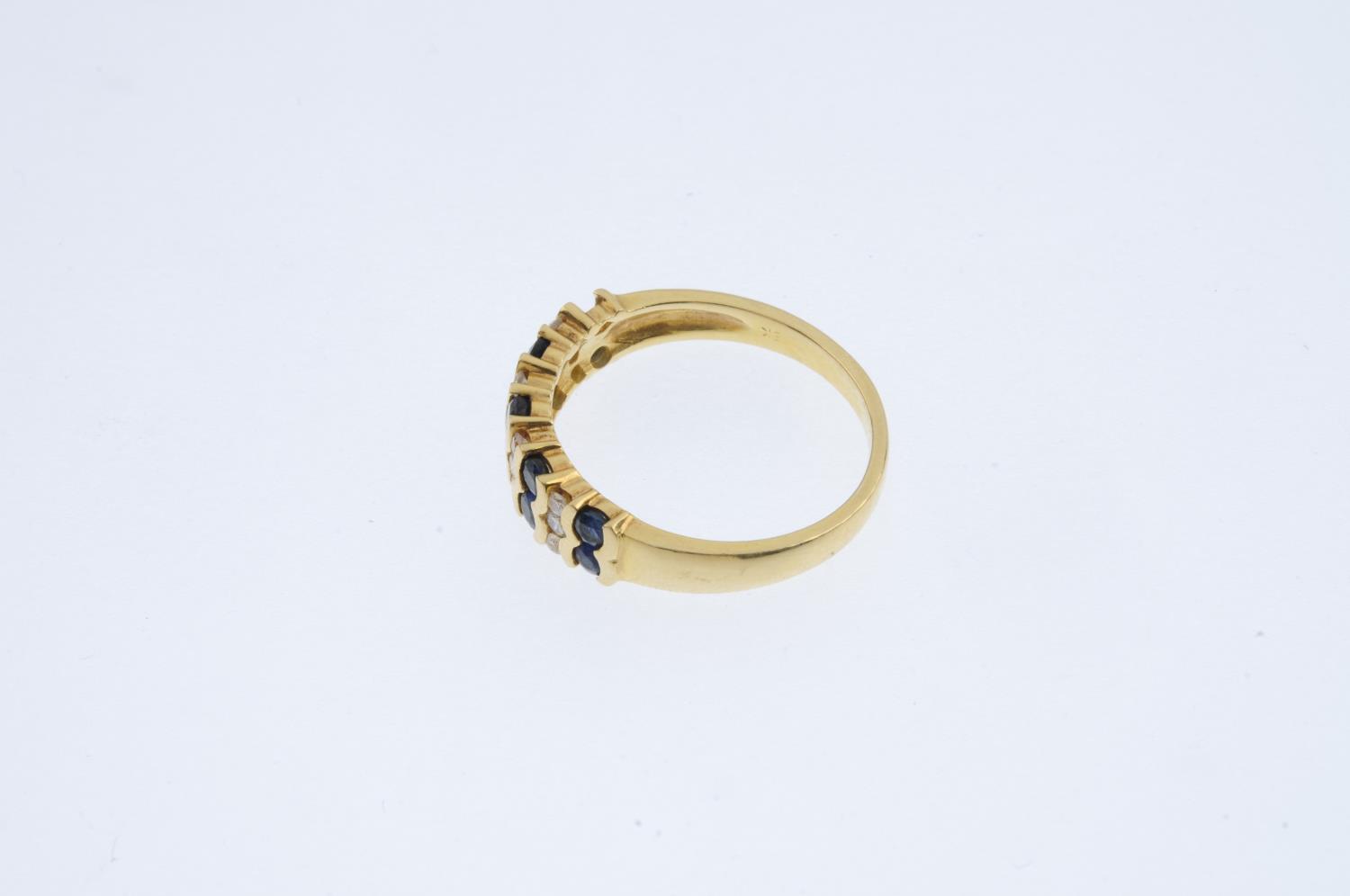 An 18ct gold sapphire and diamond ring. Designed as a series of alternating circular-shape - Image 2 of 3