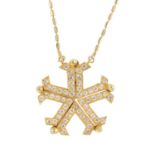 A cubic zirconia snowflake pendant. The pave-set cubic zirconia snowflake, with a series of five