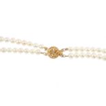 Three cultured pearl two-row necklaces. One with a 9ct gold single-cut diamond accent openwork