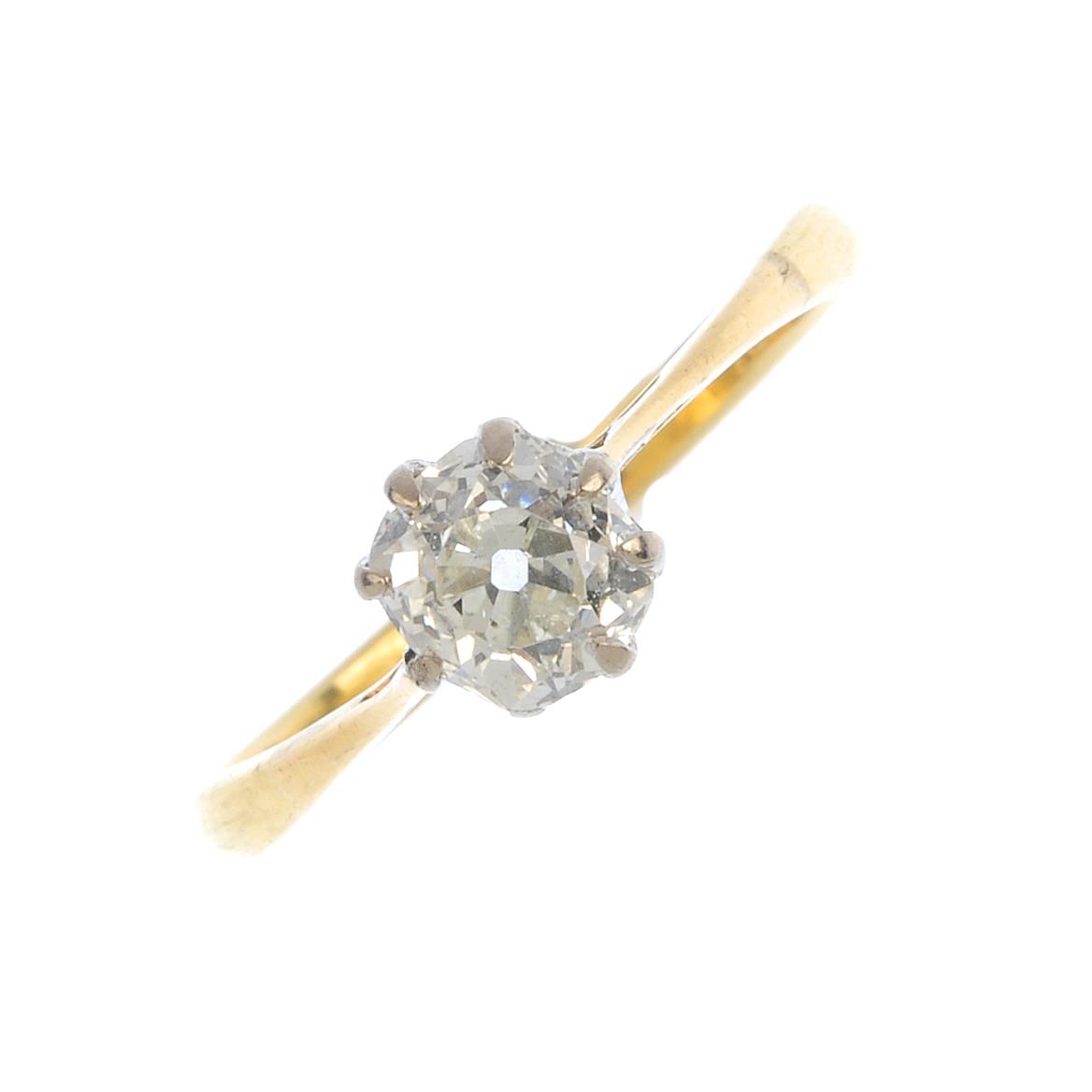 A diamond single-stone ring. The old-cut diamond, with bi-colour mount and tapered shoulders.