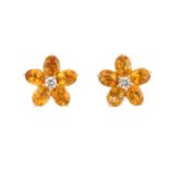 A pair of citrine and diamond cluster earrings. Each designed as a brilliant-cut diamond, with