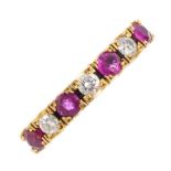 An 18ct gold ruby and diamond seven-stone ring. Designed as an alternating circular-shape ruby and