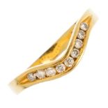 An 18ct gold diamond half eternity ring. Designed as a brilliant-cut diamond chevron, within a