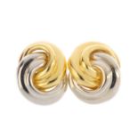 A pair of 18ct gold earrings. Each designed as a bi-colour knot. Import marks for Sheffield, 1993.