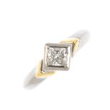 An 18ct gold diamond single-stone ring. The kite-shape diamond, with stepped sides and tapered band.