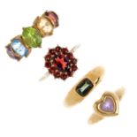 Four 9ct gold gem-set rings. To include a green tourmaline single-stone ring, a garnet cluster ring,