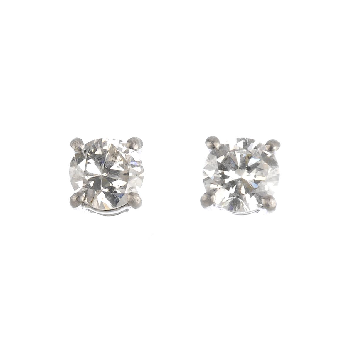 A pair of platinum brilliant-cut diamond stud earrings. Estimated total diamond weight 0.75ct , H-