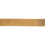 A 9ct gold bracelet. Designed as an interwoven bracelet. Hallmarks for Birmingham, 1992. Length 16.