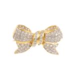A diamond bow brooch. Designed as a stylised bow, set throughout with brilliant-cut diamonds.