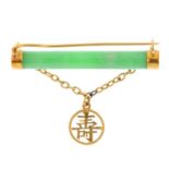 A jade brooch. The openwork drop, with oriental motif, suspended from a jade bar. Length 3.5cms.