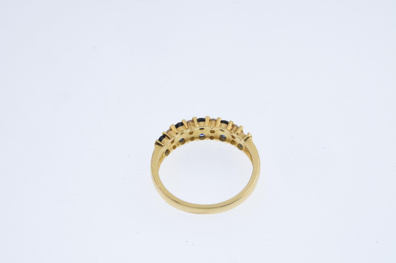 An 18ct gold sapphire and diamond ring. Designed as a series of alternating circular-shape - Image 3 of 3