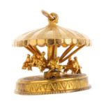 A Merry-go-Round charm. Designed as a series of six rotating horses. Length 2.5cms. Weight 13gms.