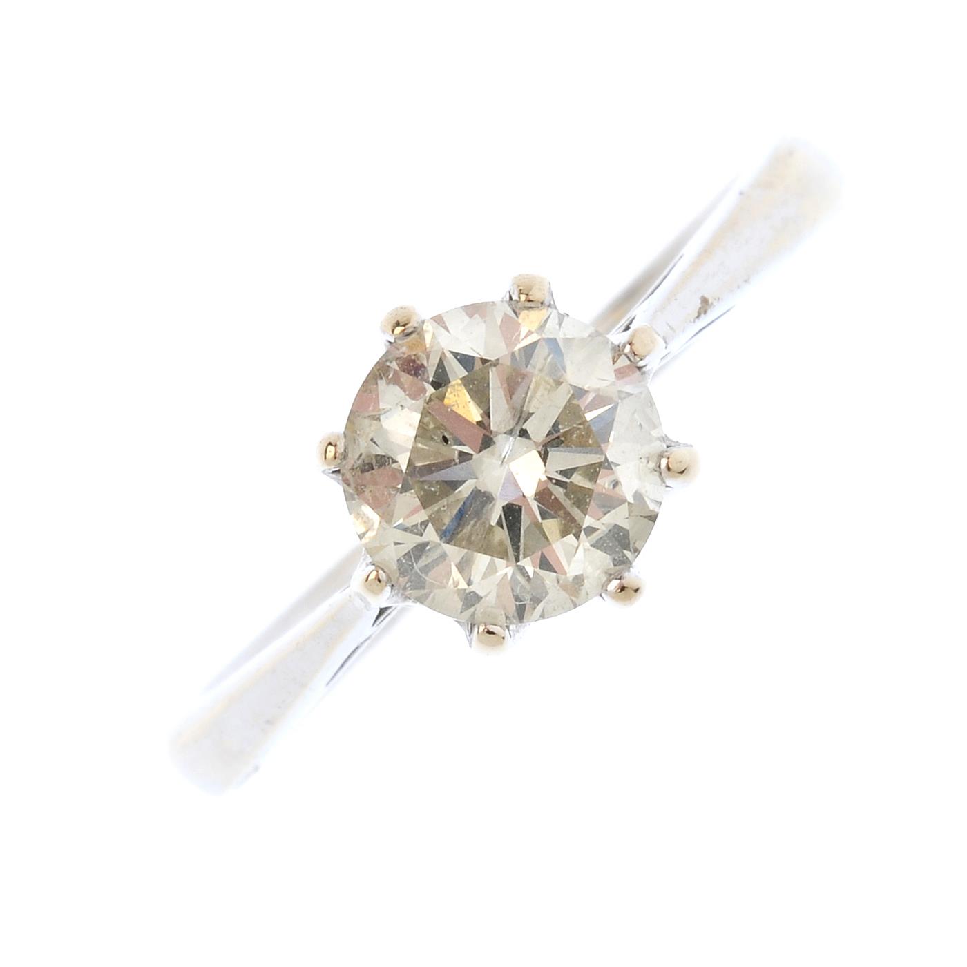 An 18ct gold diamond single-stone ring. The brilliant-cut diamond, with tapered shoulders. Estimated