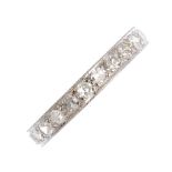 A diamond eternity ring. The single-cut diamond line, within a mille grain border. Estimated total