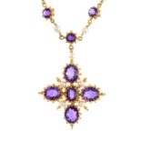 An amethyst and cultured pearl cross pendant. Designed as an oval-shape amethyst cross, with