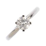 A platinum diamond single-stone ring. The brilliant-cut diamond with tapered shoulders. Diamond