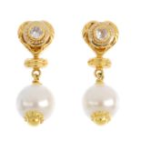 A pair of imitation pearl and cubic zirconia earrings. Each designed as an imitation pearl,