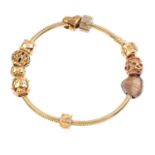 PANDORA and CLOGAU - a charm bracelet. The Pandora bracelet, suspending five Pandora and four Clogau
