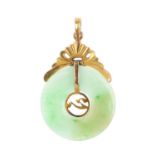 A jade pendant. Designed as a jade bi, with a textured ribbon surmount, suspending a chevron motif