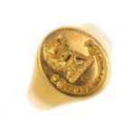 A gentleman's 18ct gold signet ring. The oval-shape panel engraved with a lion rampant crest and