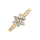 An 18ct gold diamond cluster ring. The brilliant-cut diamond cluster, with similarly-cut diamond