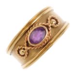 CLOGAU - a 9ct gold amethyst ring. The oval-shape amethyst collet and beaded sides, with rope-