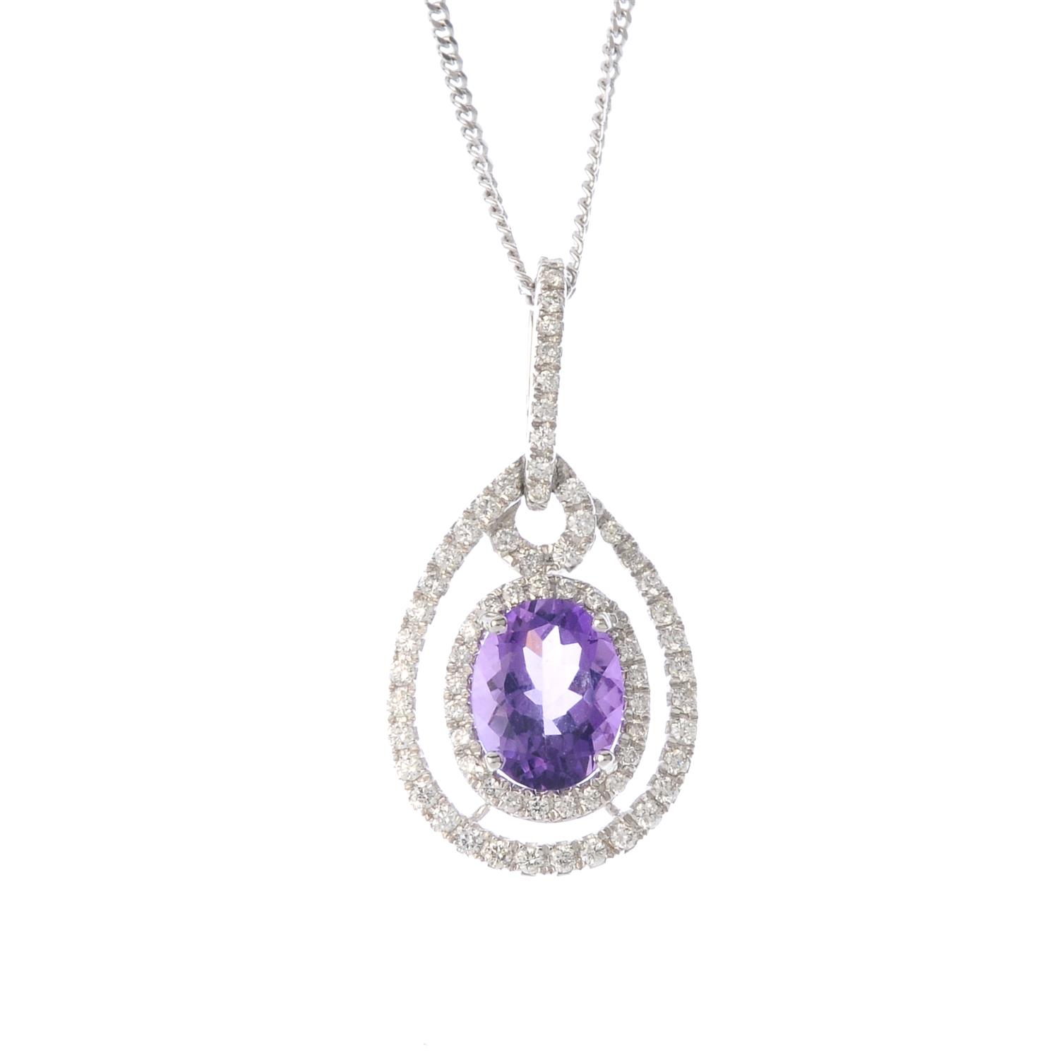 An 18ct gold amethyst and diamond pendant. The oval-shape amethyst and brilliant-cut diamond