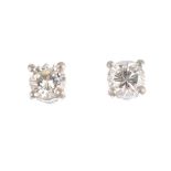 A pair of platinum brilliant-cut diamond stud earrings. Estimated total diamond weight 0.35ct, H-I