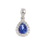 A sapphire and diamond cluster pendant. Designed as a central pear-shape sapphire within a