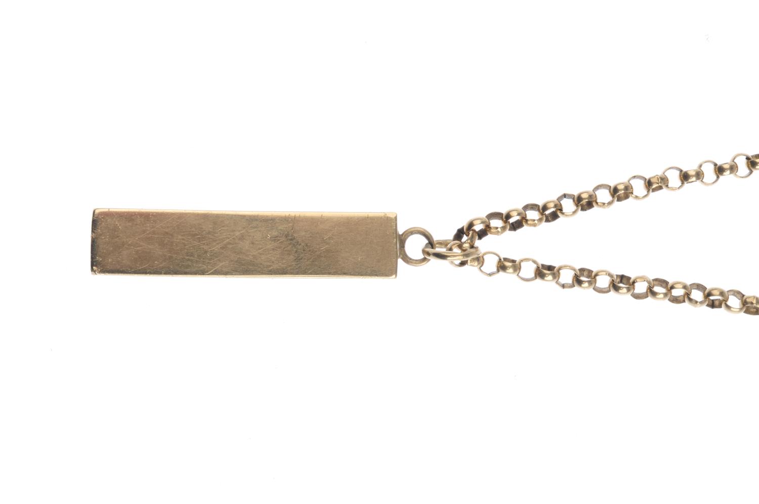 (52407) A 9ct gold pendant, with chain. Designed as a rectangular ingot bar, suspended from a - Image 2 of 3