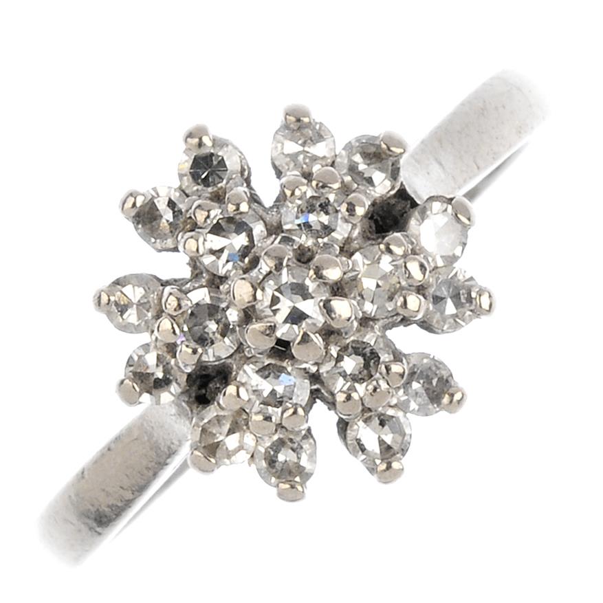 An 18ct gold diamond cluster ring. The single-cut diamond, with a trefoil surround. Estimated