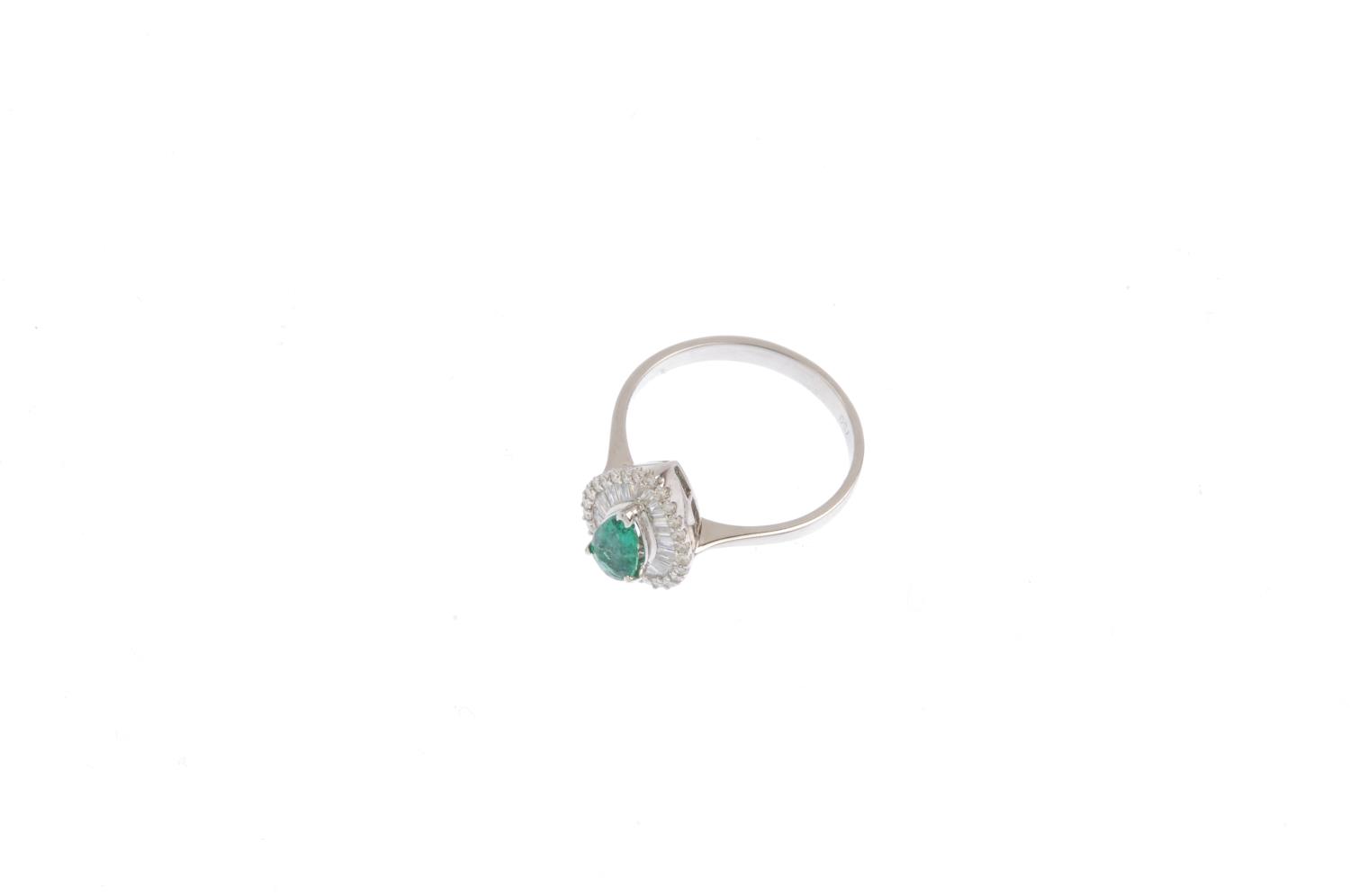 An emerald and diamond cluster ring. The pear-shape emerald, with vari-cut diamond surround. Emerald - Image 3 of 3