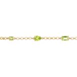 A peridot bracelet. Designed as a series of circular, pear and rectangular-shape peridots, with