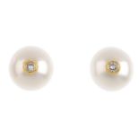 A pair of 18ct gold cultured pearl and diamond ear studs. Each designed as a cultured pearl with