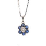 An 18ct gold sapphire and diamond pendant. The brilliant-cut diamond, with circular-shape sapphire