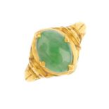 A jade dress ring. The oval jadeite cabochon, with embossed and applied foliate shoulders and sides.