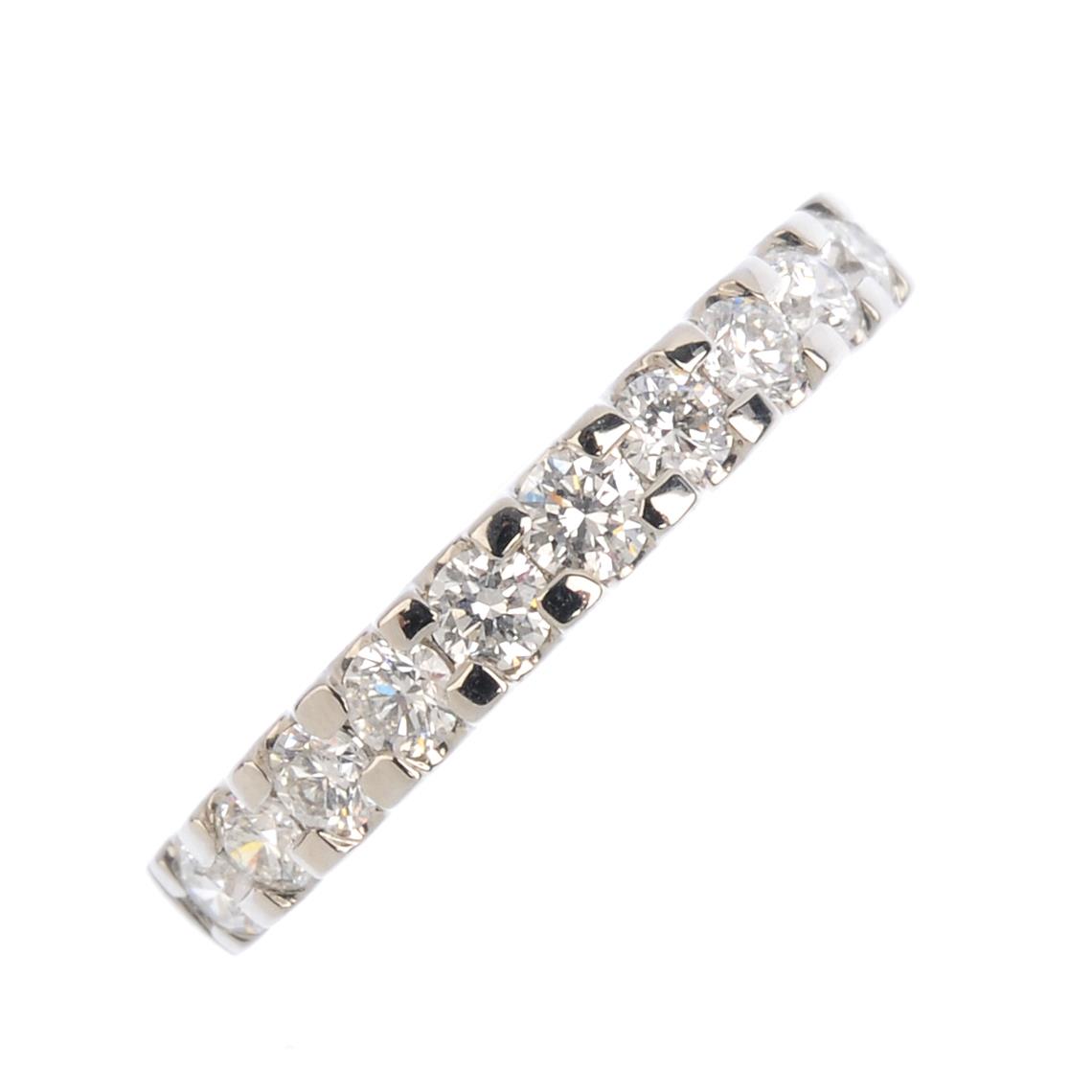 A platinum diamond half eternity ring. Designed as a brilliant-cut diamond line. Total diamond