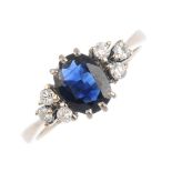 An 18ct gold sapphire and diamond dress ring. The oval-shape sapphire, with brilliant-cut diamond