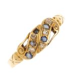 An Edwardian 18ct gold ring mount and a gem-set dress ring. The first, designed as a buckle, with