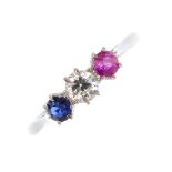 A diamond, sapphire and ruby three-stone ring. The circular shape diamond, sapphire and ruby line,