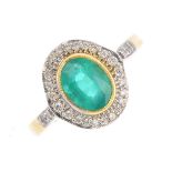 An 18ct gold emerald and diamond cluster ring. The rectangular-shape emerald collet, with a