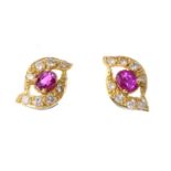 A pair of 18ct gold ruby and diamond ear studs. Each of tapered marquise shape with central oval-