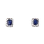 A pair of sapphire and diamond cluster ear studs. Each designed as a central rectangular-shape