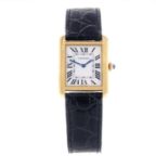 CARTIER - a Tank Solo wrist watch. Yellow metal case with stainless steel case back. Reference 3168,