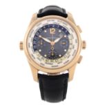 GIRARD-PERREGAUX - a gentleman's World Time chronograph wrist watch. Rose metal case with exhibition