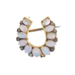 A late Victorian 15ct gold, opal and diamond horseshoe brooch. The graduated oval opal cabochon