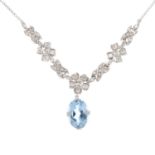 An aquamarine and diamond necklace. The oval-shape aquamarine, suspended from a series of