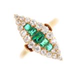 An Edwardian 18ct gold emerald and diamond cluster ring. Of marquise-shape outline, the graduated