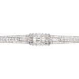 A mid 20th century diamond bracelet. The graduated brilliant-cut diamond line, with baguette-cut