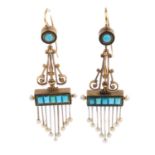 A pair of mid Victorian gold gem-set earrings. Each designed as a seed pearl terminal fringe,